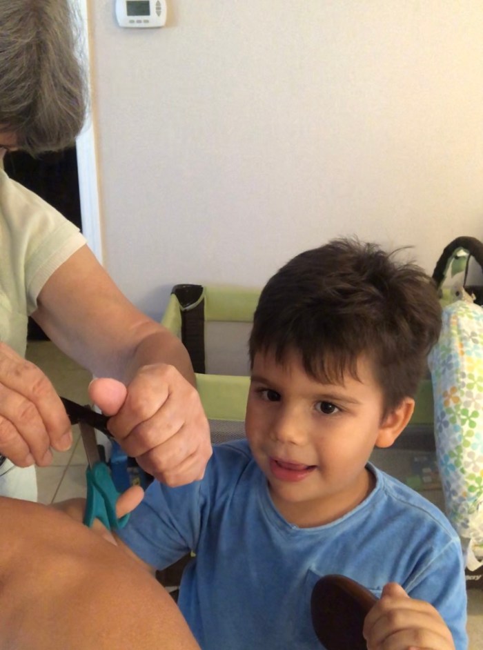 Julian Cutting Mommy's Hair
